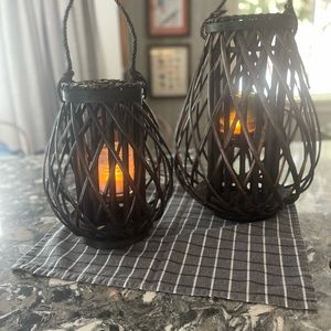Two rustic candle holders. Black basket weave.